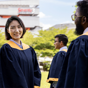 image of a graduate looking at the camera