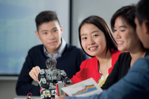 photo of a group of students with robotics