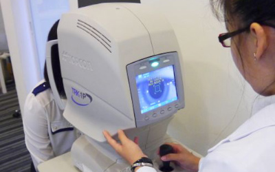 Optometrist conducting eye exam