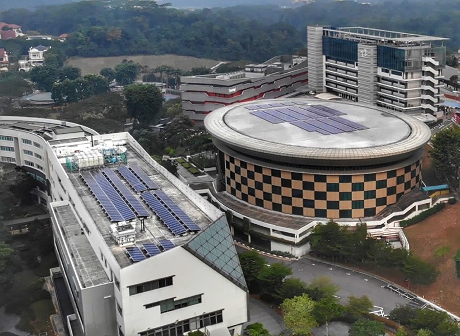 An aerial view of NP, with solar panels on a rooftop